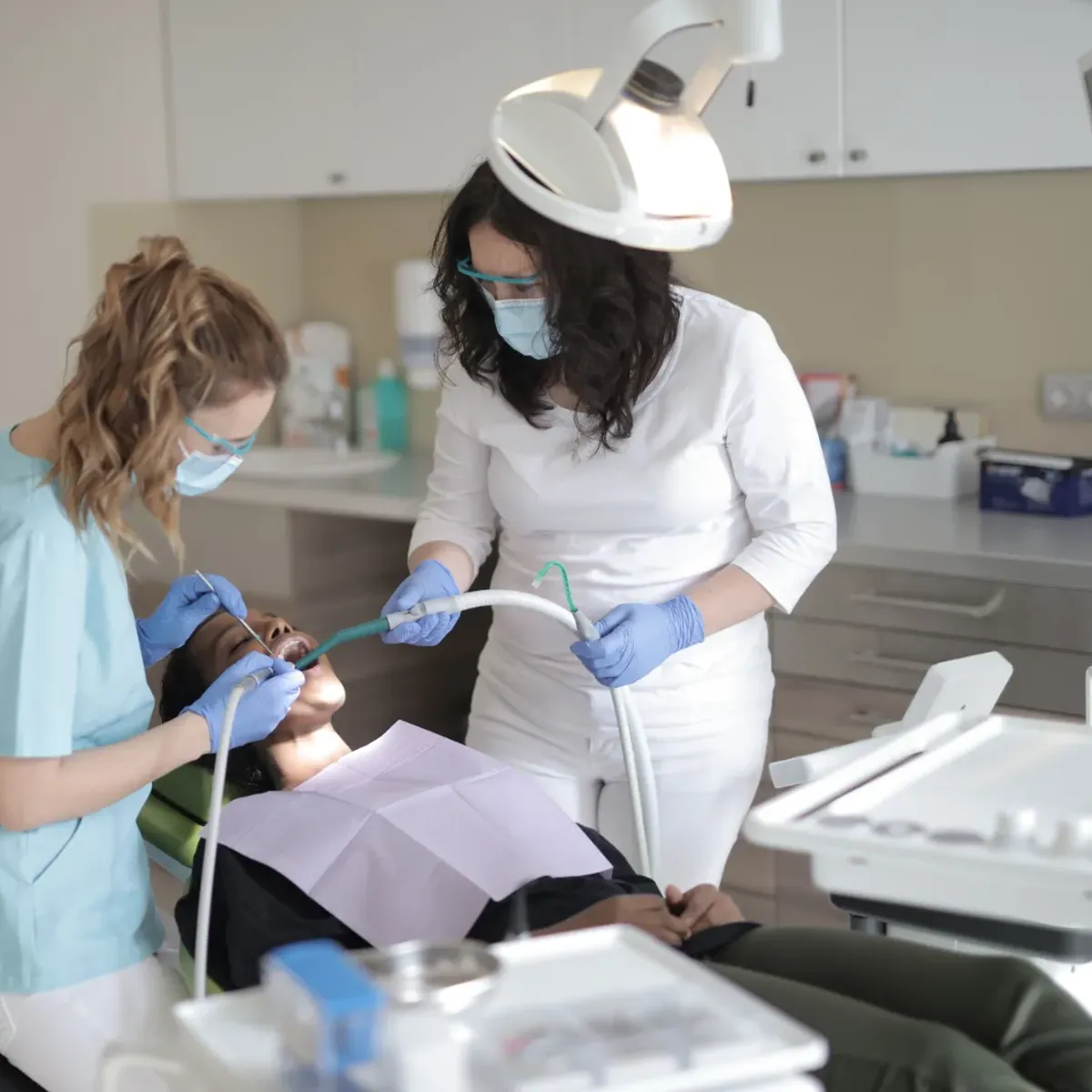 Two clinicians working together during a dental procedure
